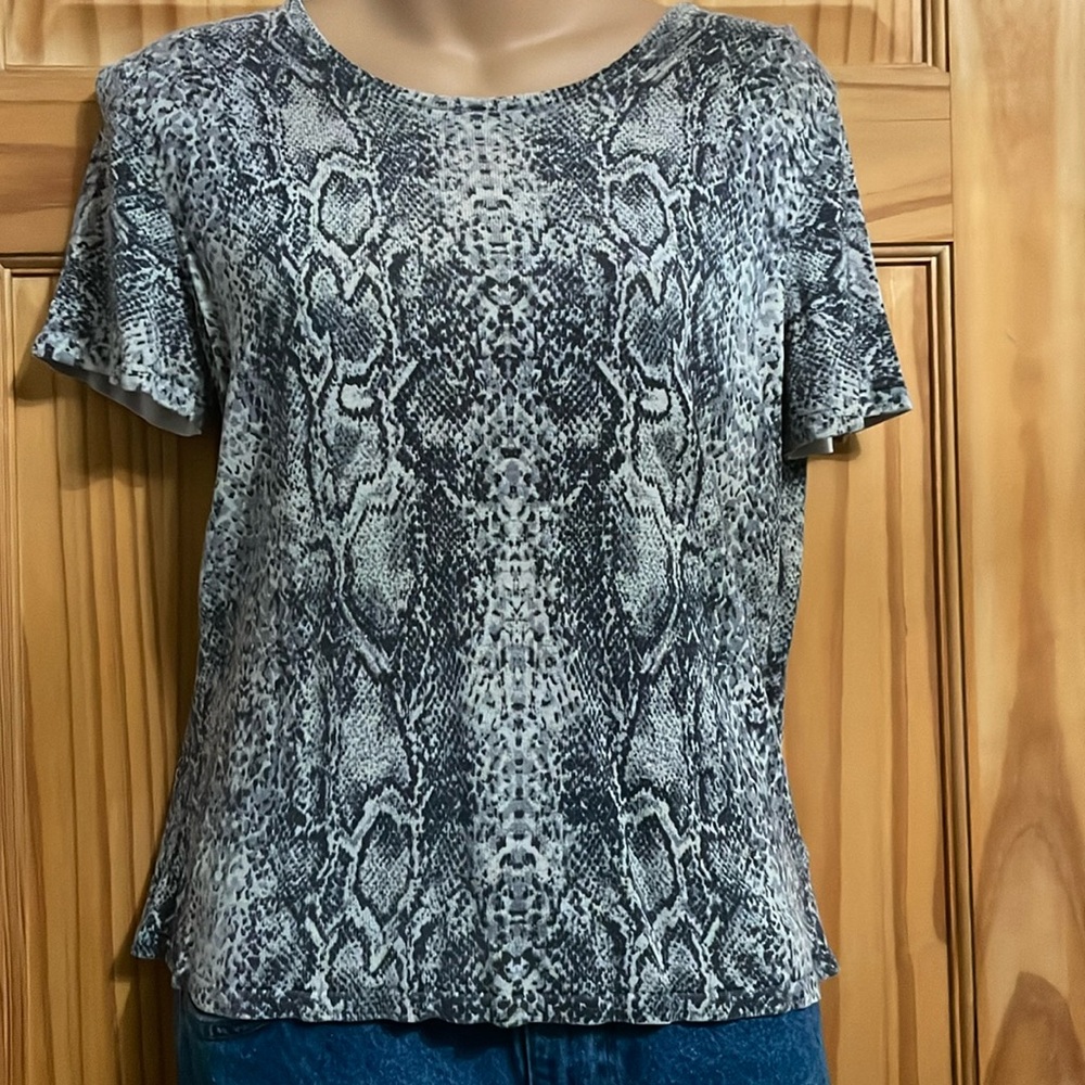 Women’s light weight short sleeved silk sweater. Cardigan sold separately.